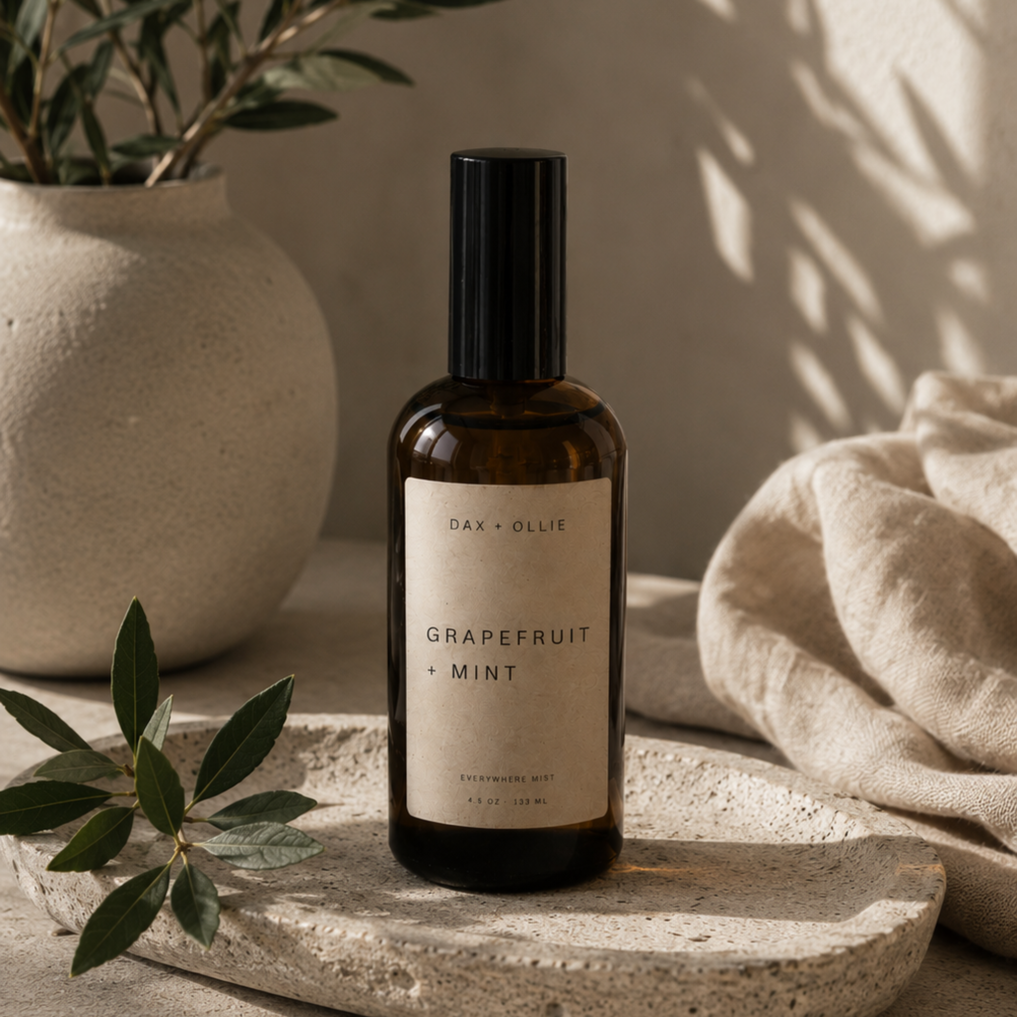 Oakmoss + Amber room and linen spray in amber glass bottle by Dax + Ollie